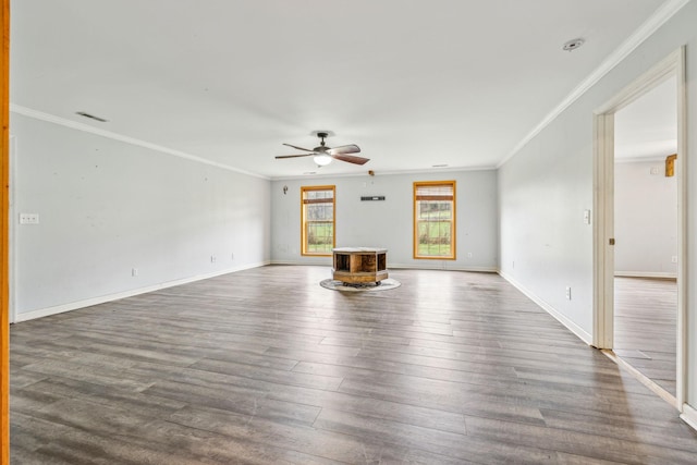 unfurnished living room with ceiling fan, wood-type flooring, and ornamental molding