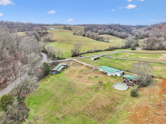 birds eye view of property with a rural view