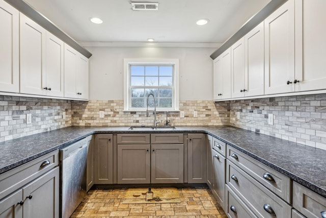 kitchen featuring stainless steel dishwasher, gray cabinetry, crown molding, sink, and white cabinetry