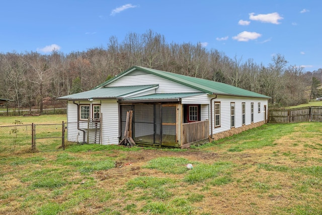 view of outdoor structure featuring a lawn