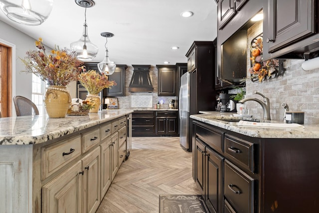 kitchen with stainless steel refrigerator, a center island, cream cabinets, light parquet floors, and decorative backsplash