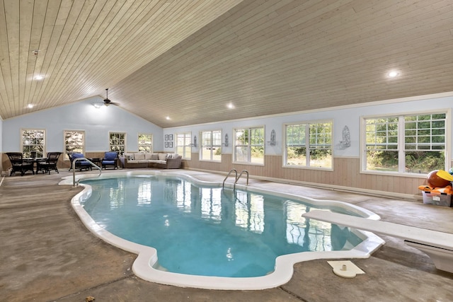 view of pool featuring a diving board and ceiling fan