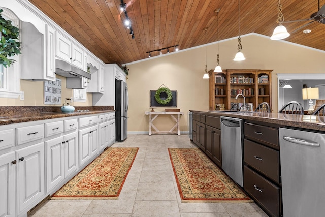 kitchen with track lighting, hanging light fixtures, appliances with stainless steel finishes, white cabinetry, and wood ceiling