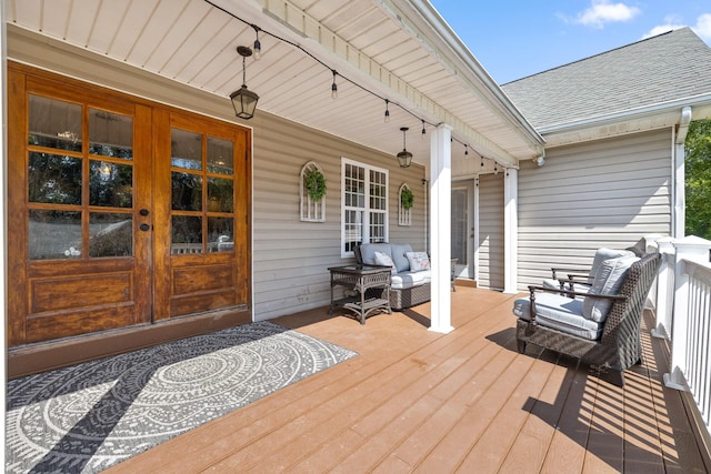 wooden deck featuring french doors