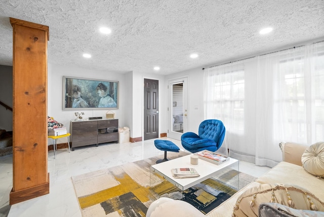 living room featuring a textured ceiling