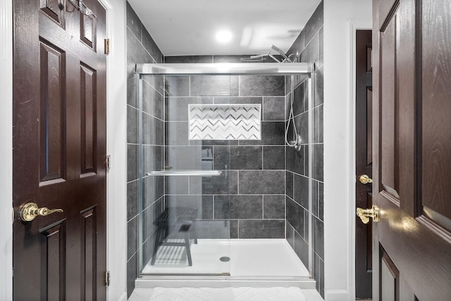 bathroom featuring an enclosed shower