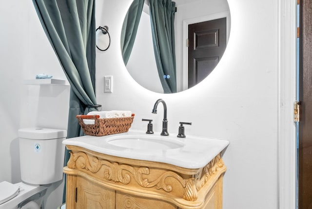 bathroom featuring vanity and toilet