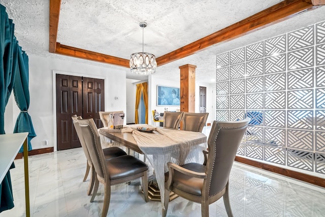 dining room featuring a textured ceiling and a notable chandelier