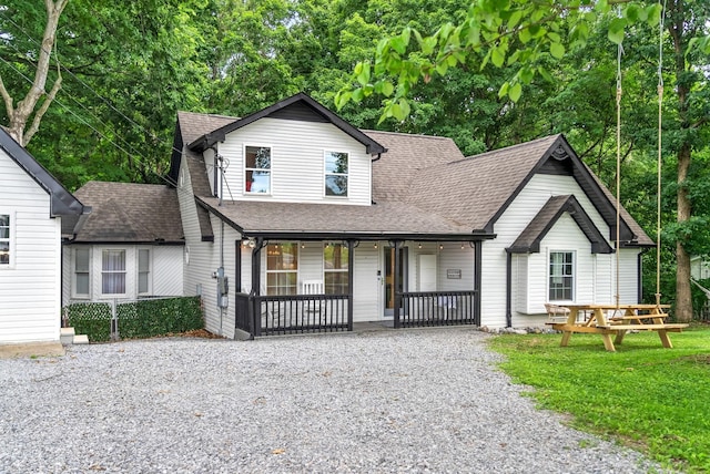 view of front of property with a front lawn and covered porch