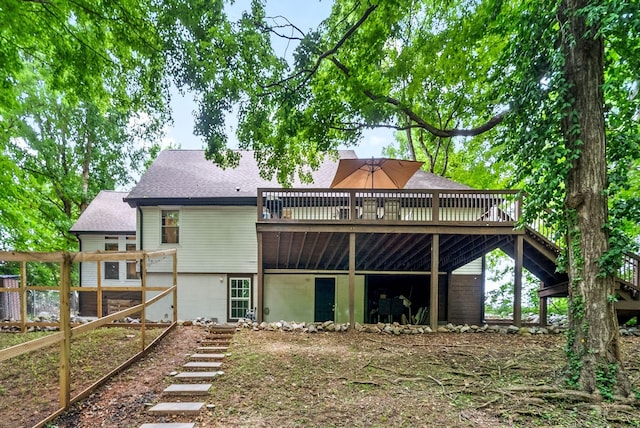 back of property featuring a deck