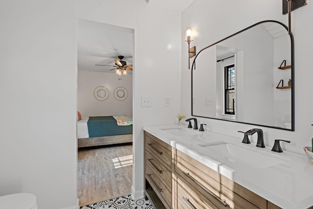 bathroom featuring vanity, hardwood / wood-style flooring, and ceiling fan