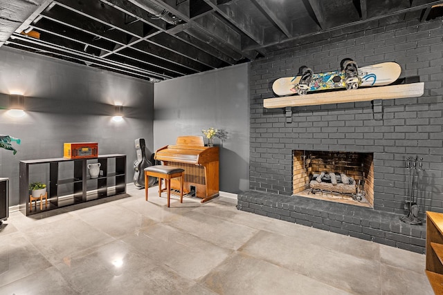 basement featuring brick wall and a brick fireplace