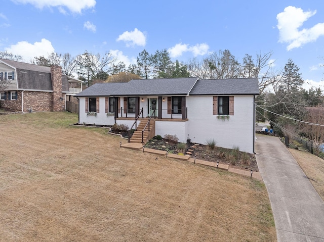 view of front of home with a front lawn and covered porch