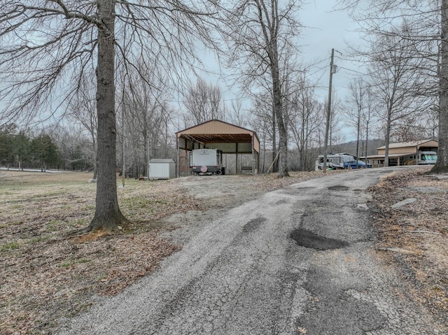 view of road featuring aphalt driveway