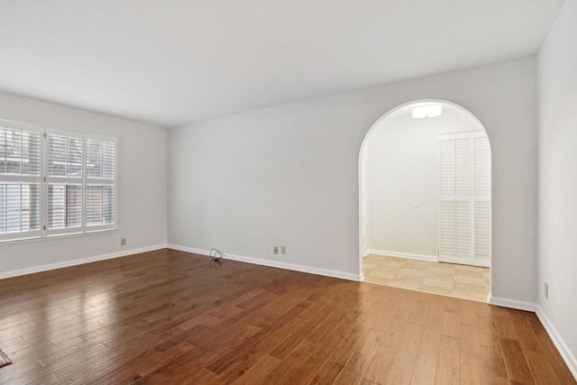 empty room featuring wood-type flooring