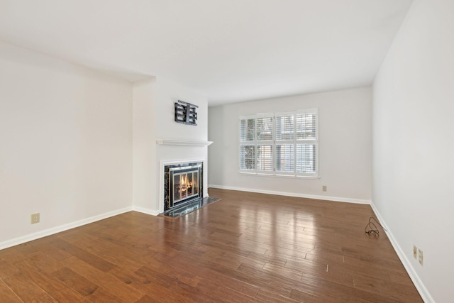 unfurnished living room featuring dark wood-type flooring