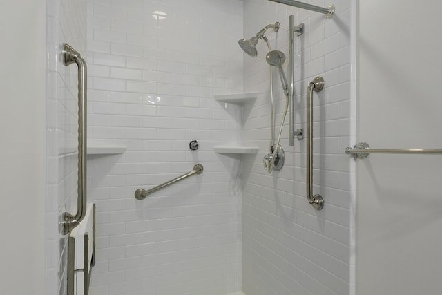 bathroom with a tile shower