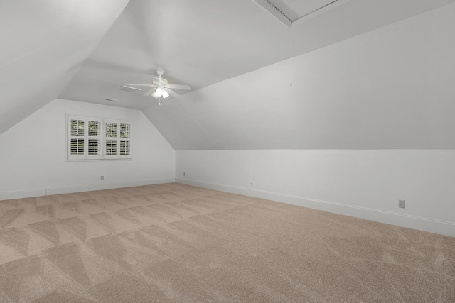 bonus room featuring ceiling fan, light colored carpet, and vaulted ceiling