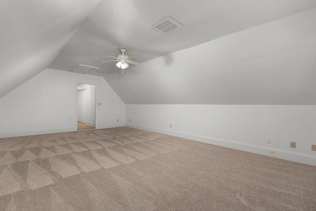 bonus room with ceiling fan, light colored carpet, and lofted ceiling