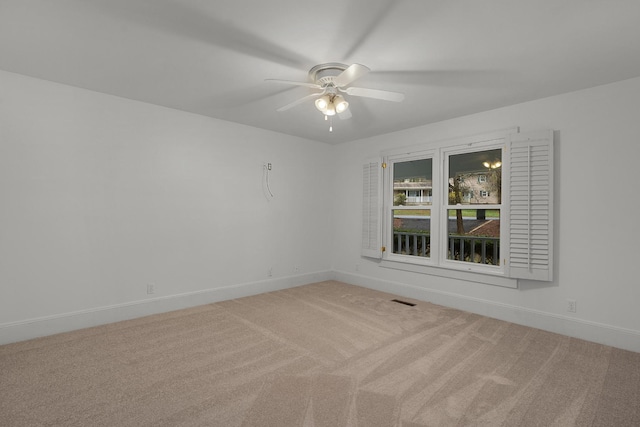 unfurnished room featuring carpet flooring and ceiling fan