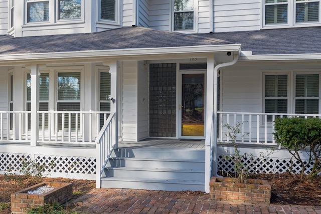 entrance to property featuring a porch