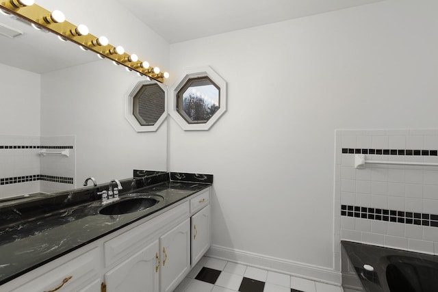 bathroom featuring a tub and vanity