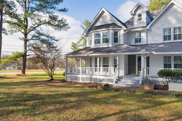 view of front facade with covered porch and a front lawn