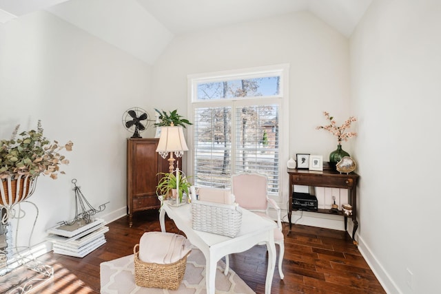 living area with dark hardwood / wood-style flooring and vaulted ceiling