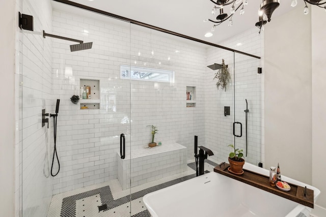 bathroom with separate shower and tub