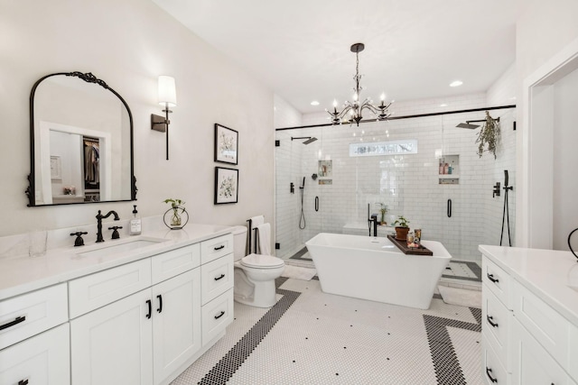 full bathroom with shower with separate bathtub, vanity, toilet, and a notable chandelier