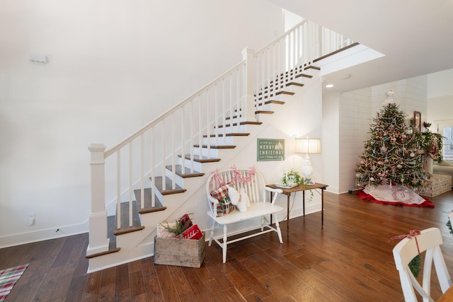 staircase with wood-type flooring