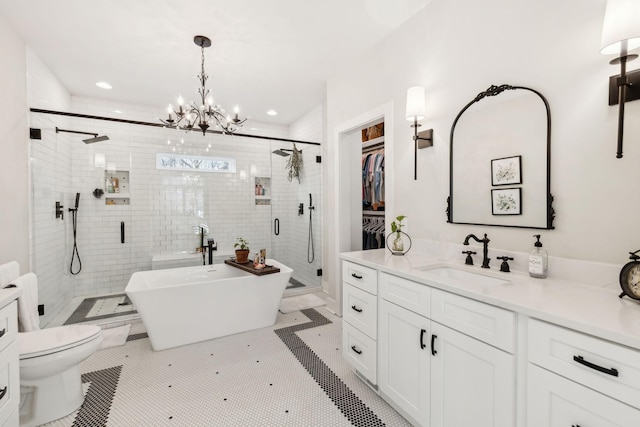 full bathroom featuring an inviting chandelier, tile patterned flooring, toilet, vanity, and shower with separate bathtub