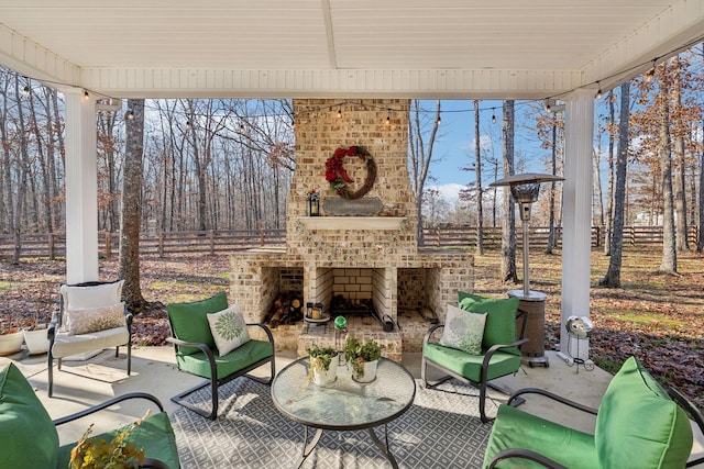 unfurnished sunroom with an outdoor brick fireplace