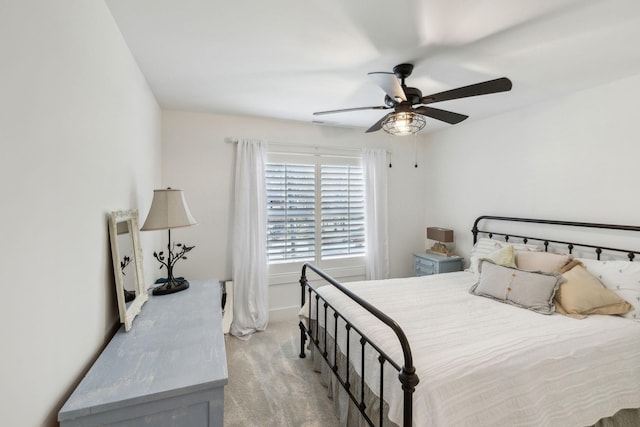 bedroom with light colored carpet and ceiling fan