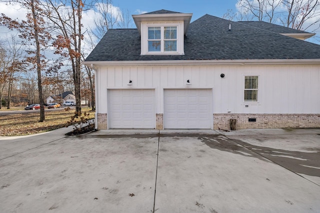 view of side of property featuring a garage