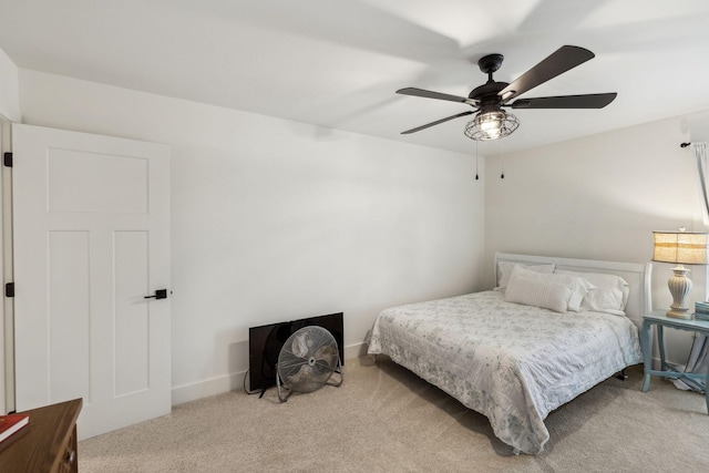 bedroom featuring ceiling fan and light carpet