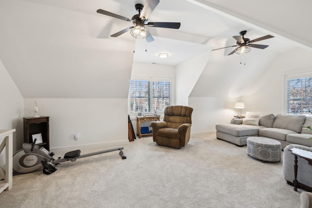 carpeted living room featuring ceiling fan and vaulted ceiling