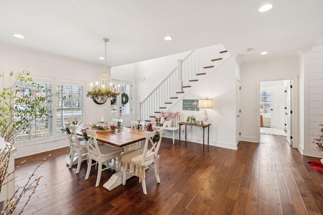 dining area featuring a notable chandelier and dark hardwood / wood-style flooring