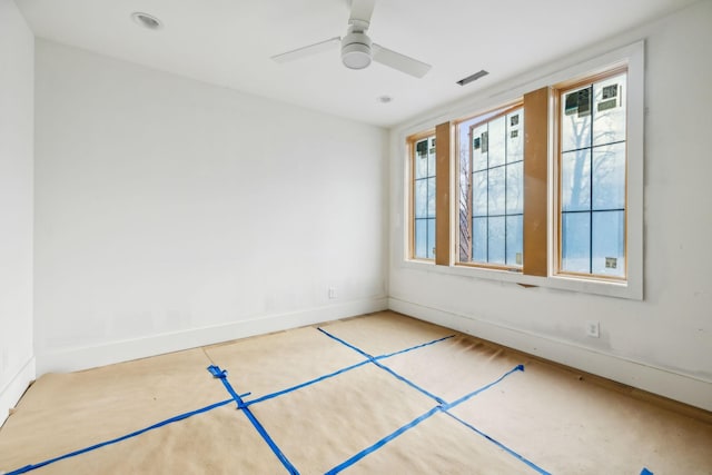 unfurnished room with ceiling fan