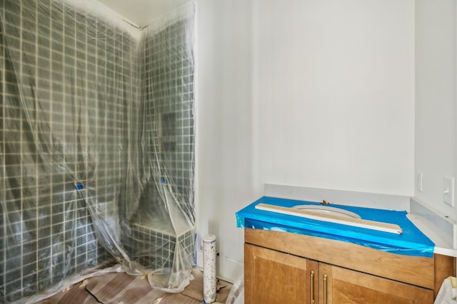 bathroom with vanity and wood-type flooring