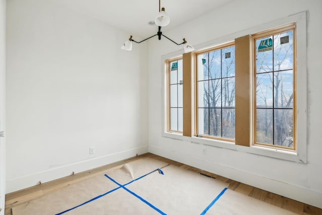 spare room featuring hardwood / wood-style flooring