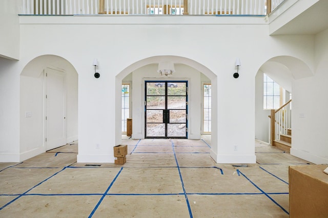 entrance foyer featuring a notable chandelier and a high ceiling