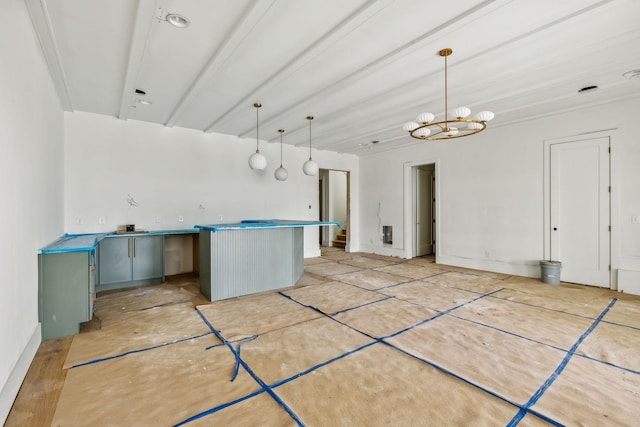 kitchen with kitchen peninsula, decorative light fixtures, an inviting chandelier, and light hardwood / wood-style flooring