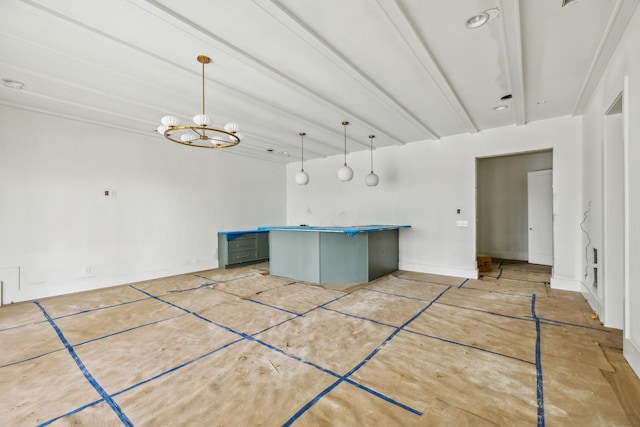 kitchen with a notable chandelier, decorative light fixtures, and beamed ceiling