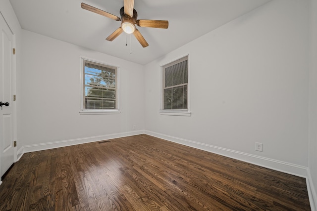 unfurnished room featuring ceiling fan and dark hardwood / wood-style flooring