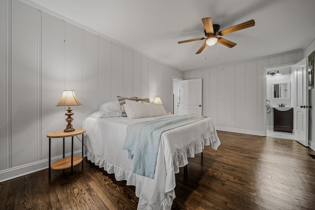 bedroom with ceiling fan, dark hardwood / wood-style flooring, and ornamental molding