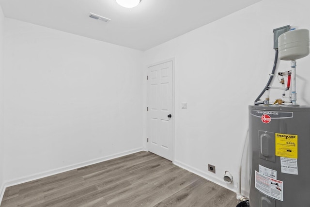 utility room featuring electric water heater