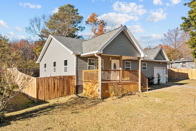 view of front of home featuring covered porch and a garage