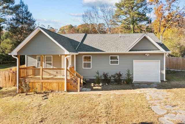 ranch-style home featuring a porch and a garage