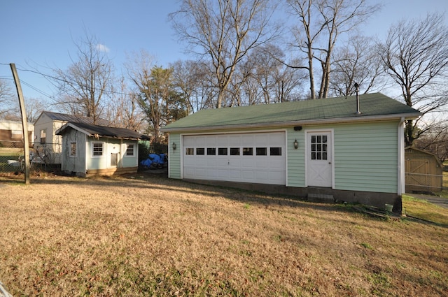 garage with a yard